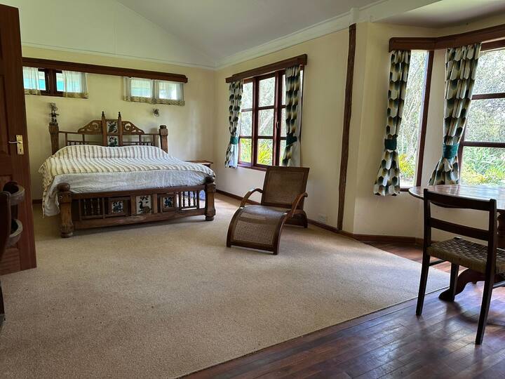 Cozy living room with fireplace at Kedong Cottage Kedong Cottage bedroom