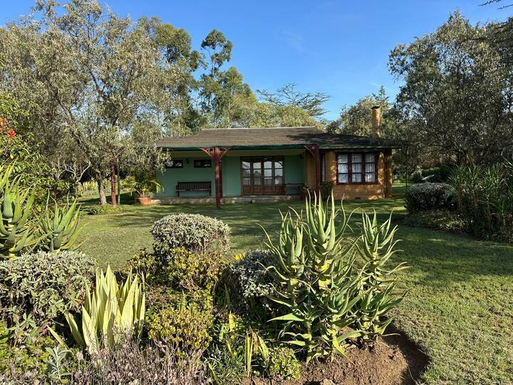 Manicured gardens with Leleshwa vegetation at Kedong Cottage BNB keyna