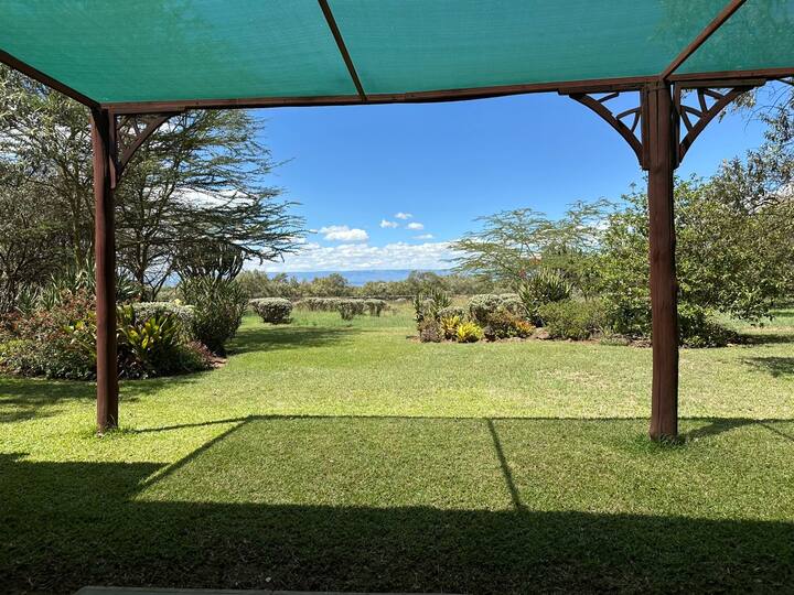 Kedong Cottage exterior with views of Lake Naivasha and Mt Longonot Kedong Cottage garden